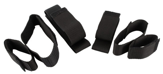 Schwarze Bad Kitty Arm- und Fußfesseln aus Leder für BDSM, mit Schnallenverschluss und gepolsterten Riemen.